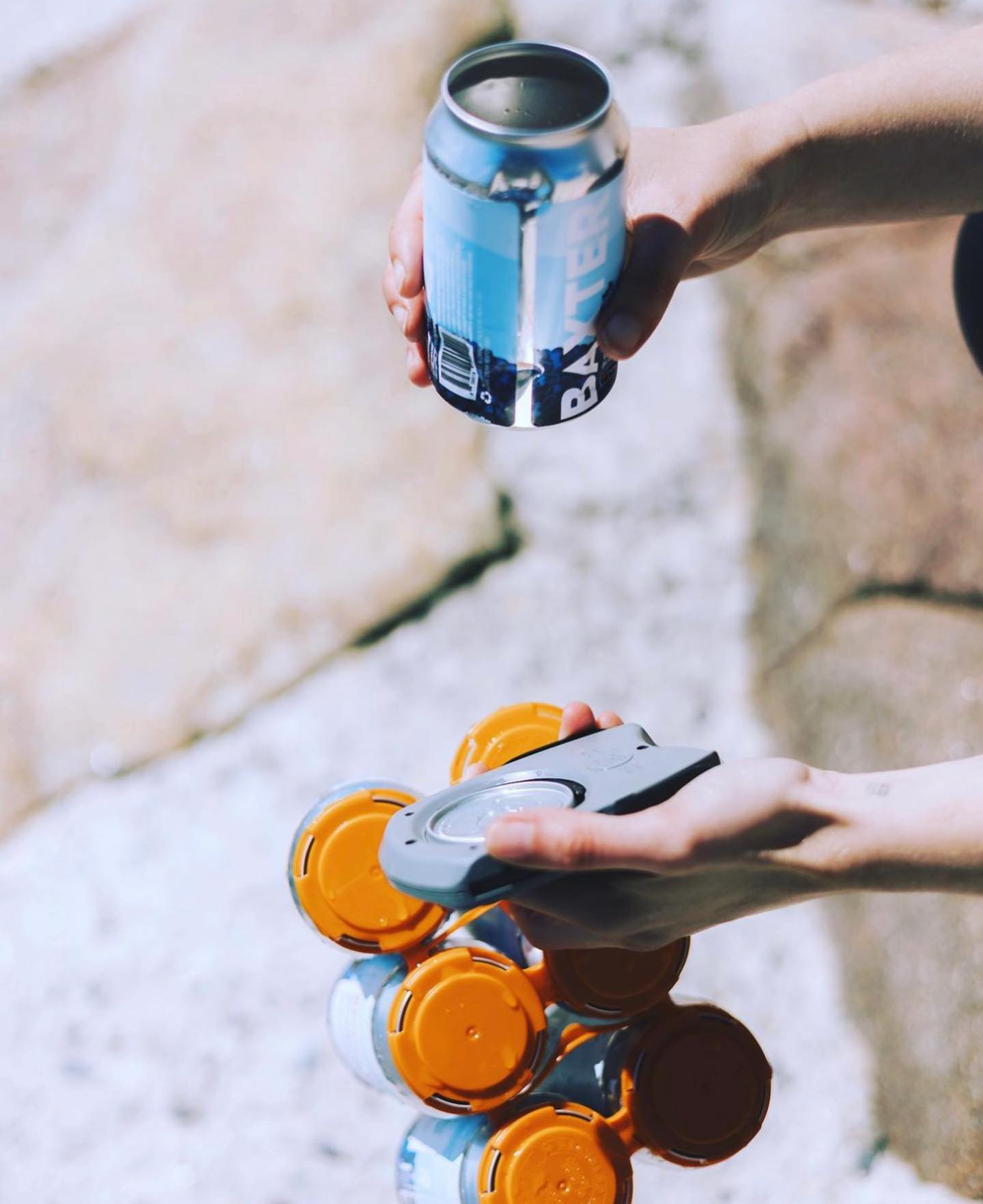 This beverage opener removes the lid from beer and soda cans